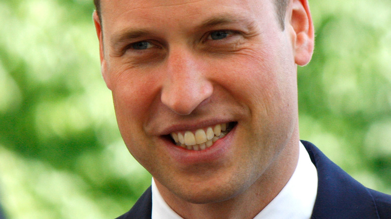 Prince William smiling for camera