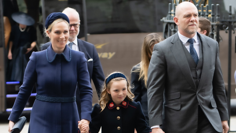 Zara Tindall, Mia Tindall, and Mike Tindall walking together