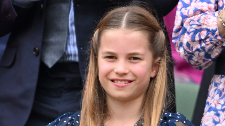 Princess Charlotte smiling at a sporting event