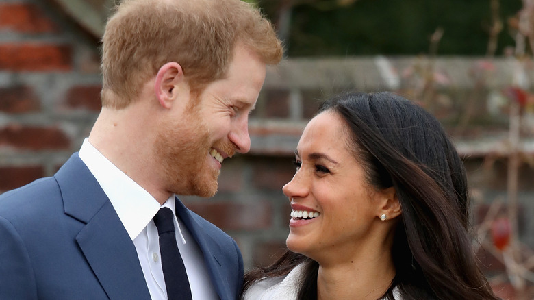 Prince Harry and Meghan Markle smiling