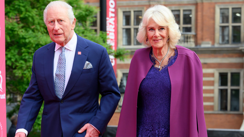 King Charles III and Queen Camilla walking side by side