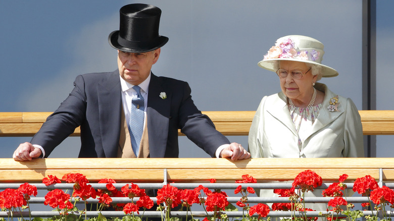 Prince Andrew and Queen Elizabeth looking annoyed