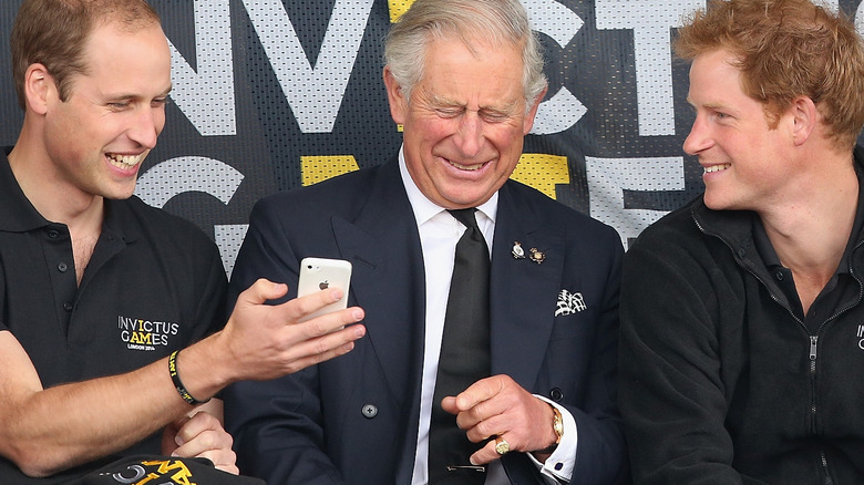 Prince Charles with sons William and Harry laughing