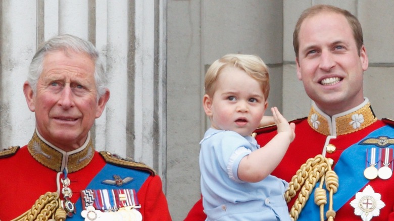 King Charles and Prince William standing on the Buckingham Palace balcony