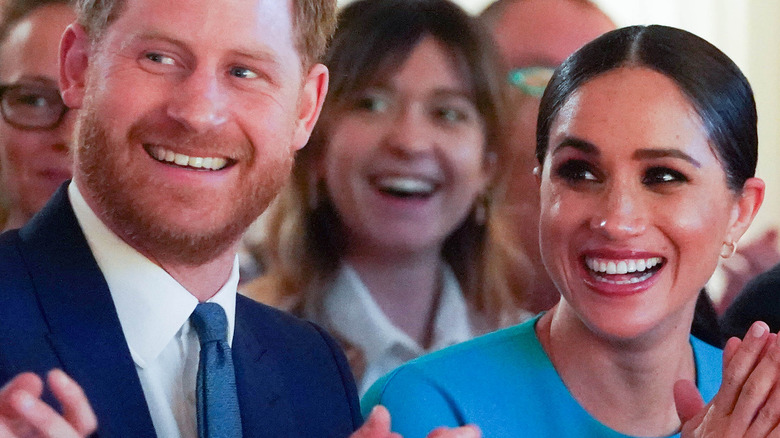 Prince Harry and Meghan Markle smile