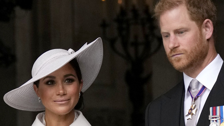 Meghan Markle and Prince Harry look perturbed at the Platinum Jubilee