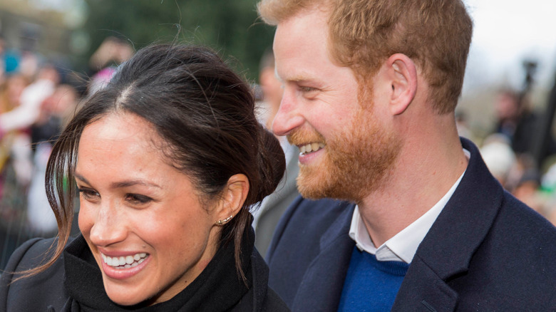 Prince Harry with wife Meghan Markle