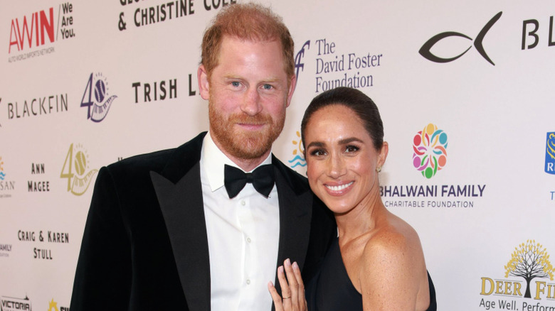 Prince Harry and Meghan Markle smiling