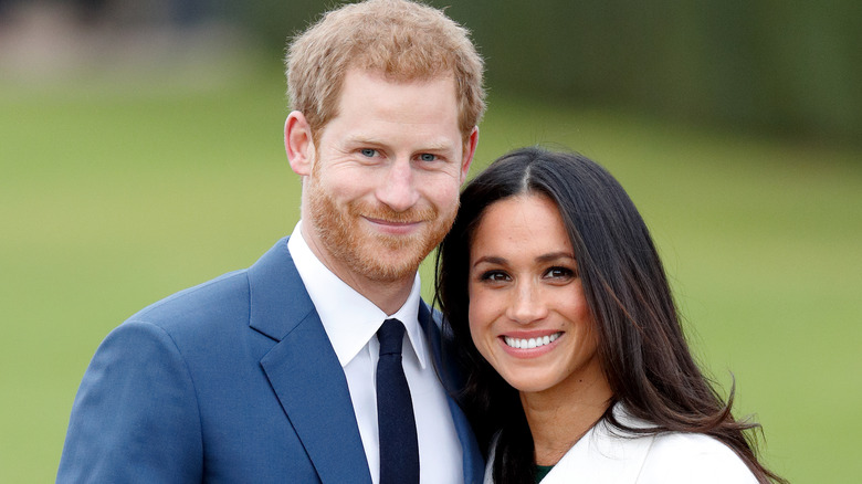 Prince Harry and Meghan Markle smiling