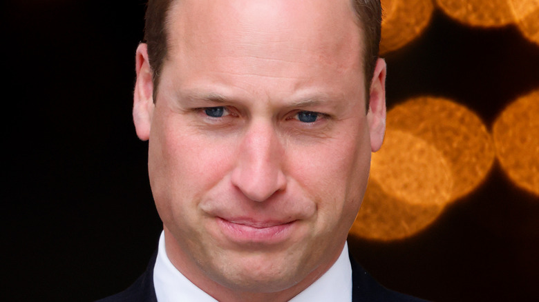 Prince William looking solemn