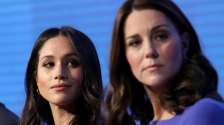 Kate Middleton and Meghan Markle at an event. 