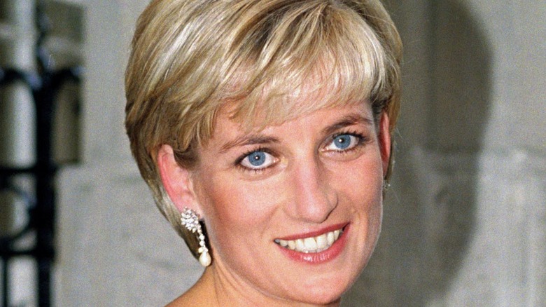 Princess Diana smiling in white dress