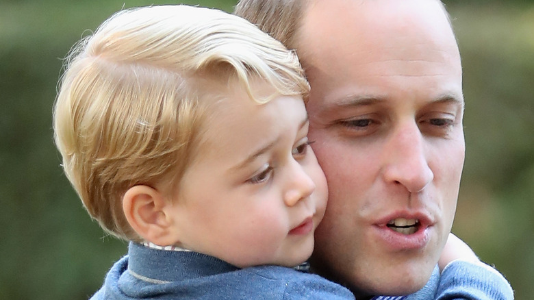 Prince George cuddles up to father Prince William