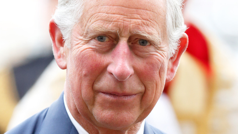 King Charles smile light blue suit
