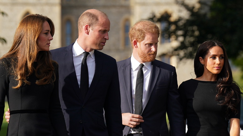 Kate Middleton, Prince William, Prince Harry, and Meghan Markle walking