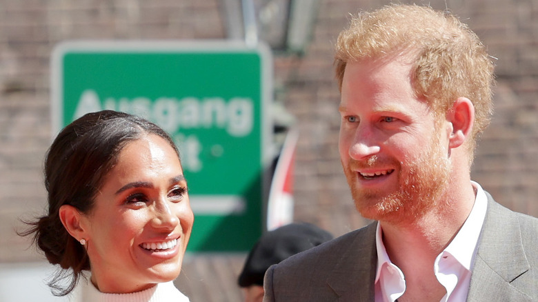 Meghan Markle looking sideways at Prince Harry