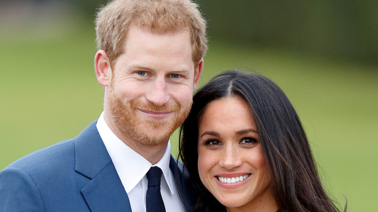 Prince Harry and Meghan Markle smiling