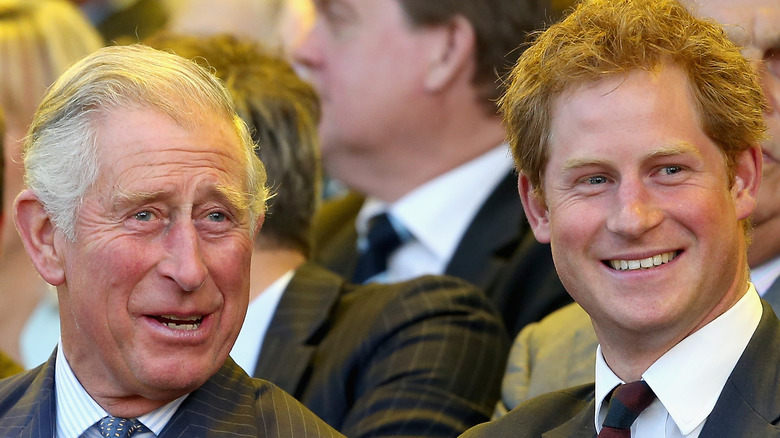 King Charles III and Prince Harry laughing