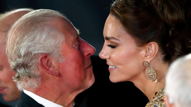 Prince Charles and Kate Middleton smiling and close to each other