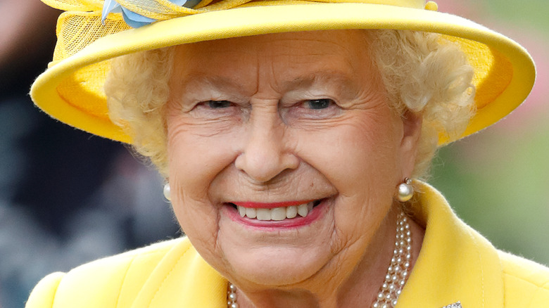 Queen Elizabeth smiles for a photo.  