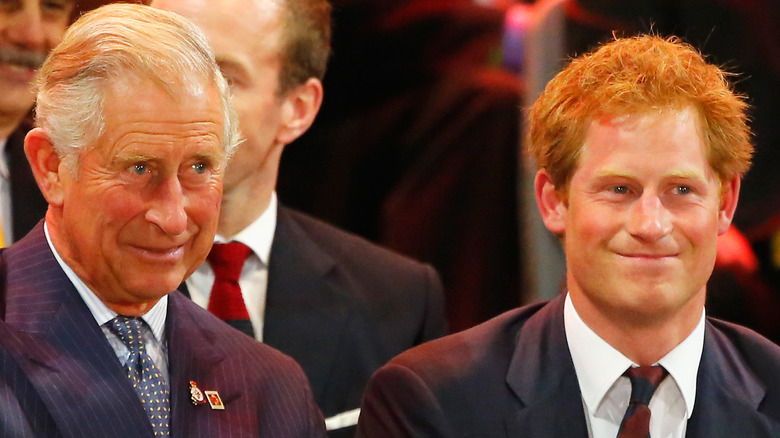 king charles III and Prince Harry laughing