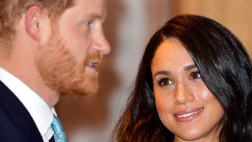 Meghan Markle looking lovingly at Prince Harry