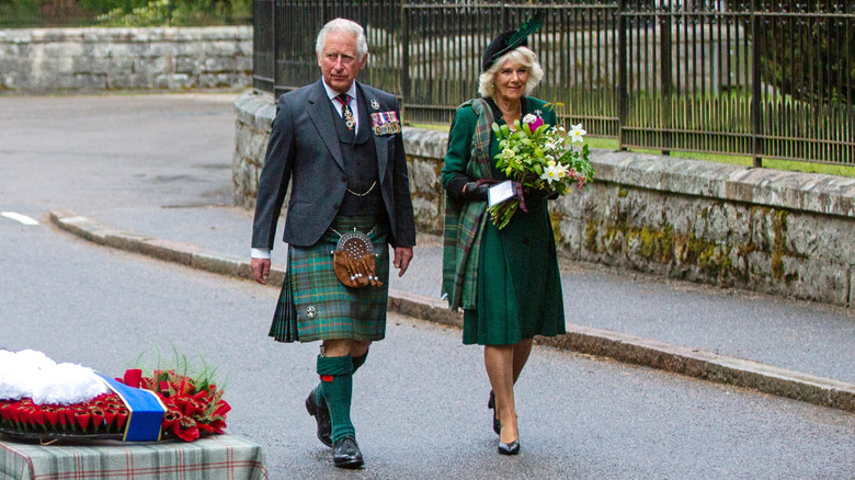 King Charles III and Queen Camilla walking
