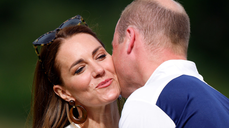 William kisses Kate's cheek
