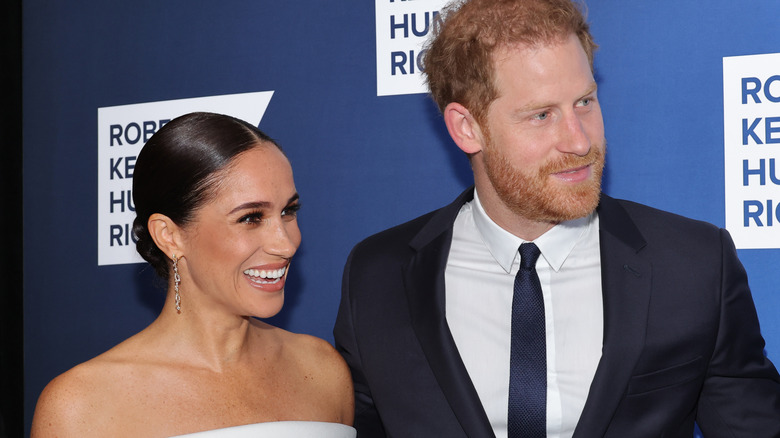 Meghan Markle laughing with Prince Harry