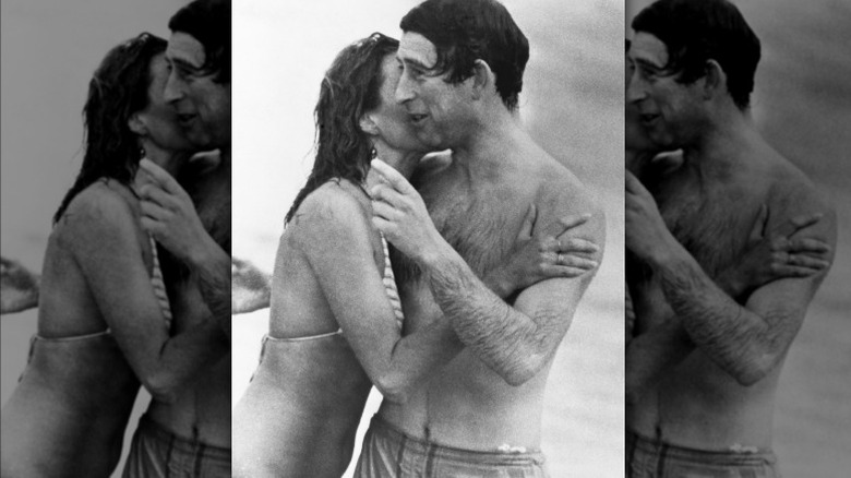 King Charles III pictured with a woman on the beach