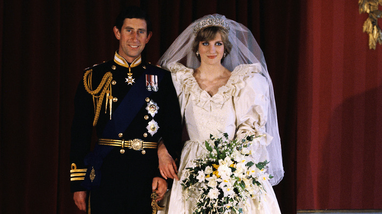 Princess Diana and Prince Charles riding in a carriage on their wedding day