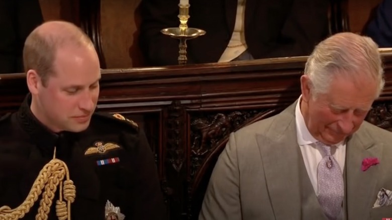 Prince William sitting next to Prince Charles at Prince Harry's wedding