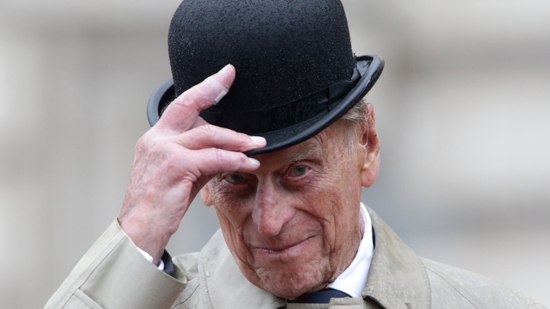 Prince Philip tipping hat 