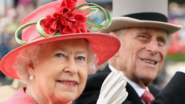 Regal Taurus Queen Elizabeth riding in a car with Prince Charles