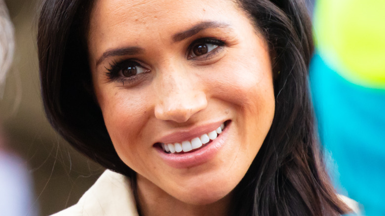 Meghan Markle tilt head smile