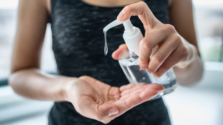 Woman applying product to her hand