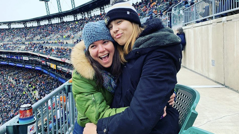 Ellen Latzen and a friend watching a football game