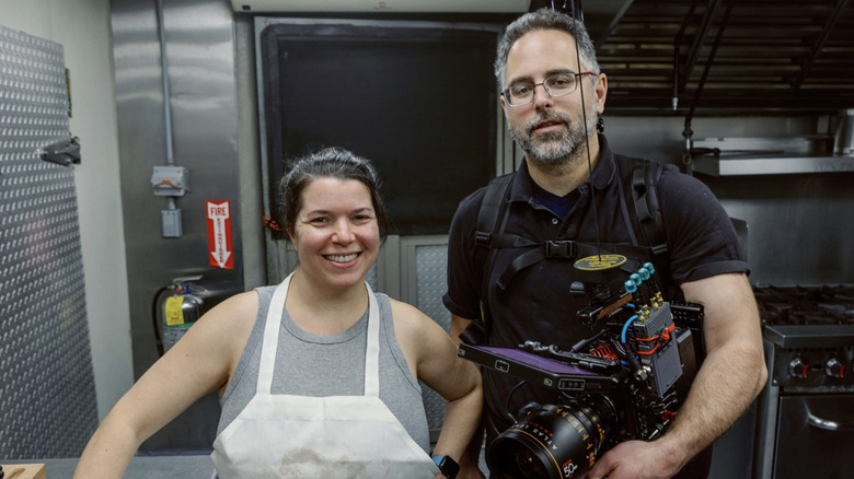 Ellen Latzen and Scott Goldberg smiling and posing together on the set of "The Forest Hills"