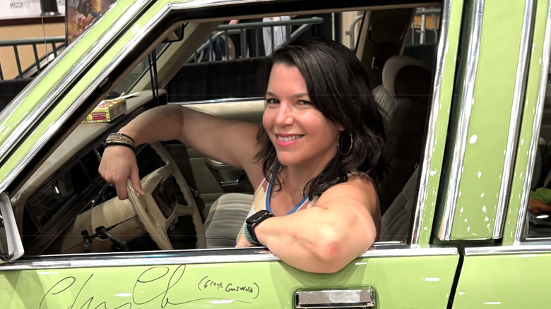 Ellen Latzen poses in a vintage car