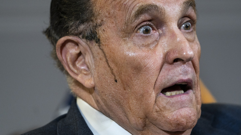 Rudy Giuliani looking terrified while sweating off his hair dye
