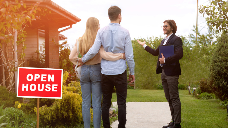 Couple viewing home with agent