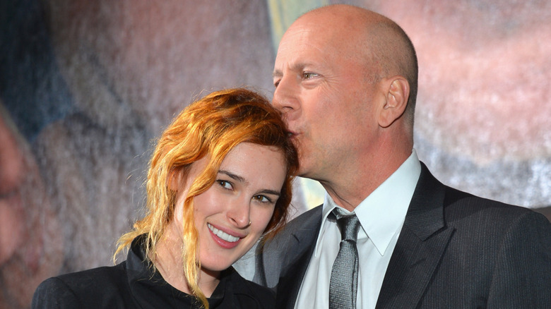 Bruce Willis kissing Rumer Willis on the head