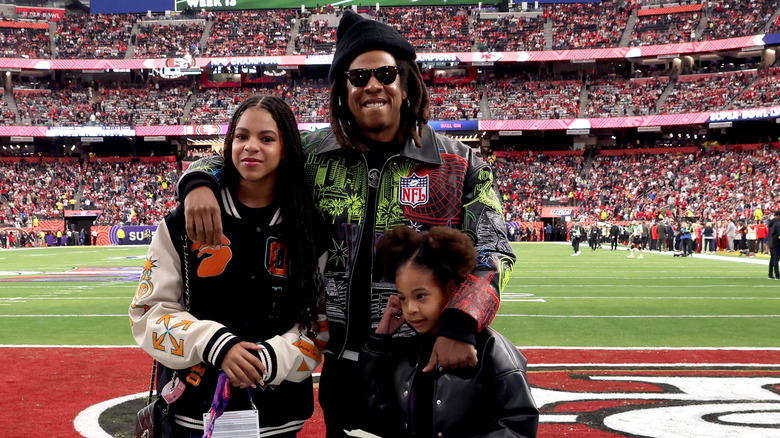 Jay-Z, Blue Ivy, and Rumi Carter at Super Bowl pregame 