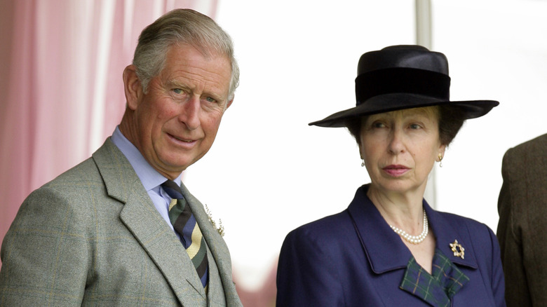 King Charles and Princess Anne standing together