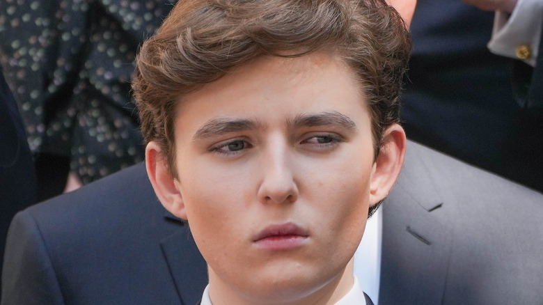 Barron Trump looking serious at funeral