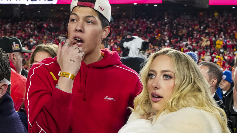 Jackson and Brittany Mahomes on the field post-AFC Championship Game 2025