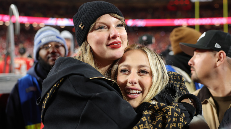 Taylor Swift and Brittany Mahomes hugging after the AFC Championship Game 2025