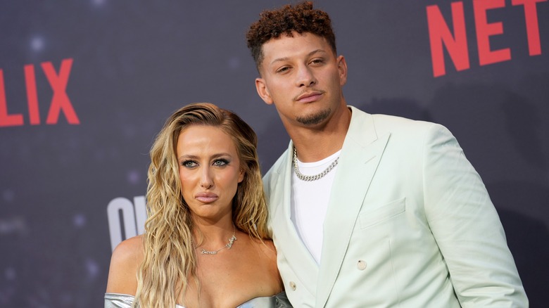 spouses Brittany and Patrick Mahomes posing