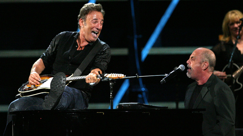 Bruce Springsteen and Billy Joel perform onstage at the 25th Anniversary Rock & Roll Hall of Fame Concert at Madison Square Garden on October 29, 2009 in New York City.