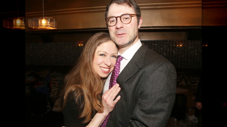 Chelsea Clinton hugging Marc Mezvinsky